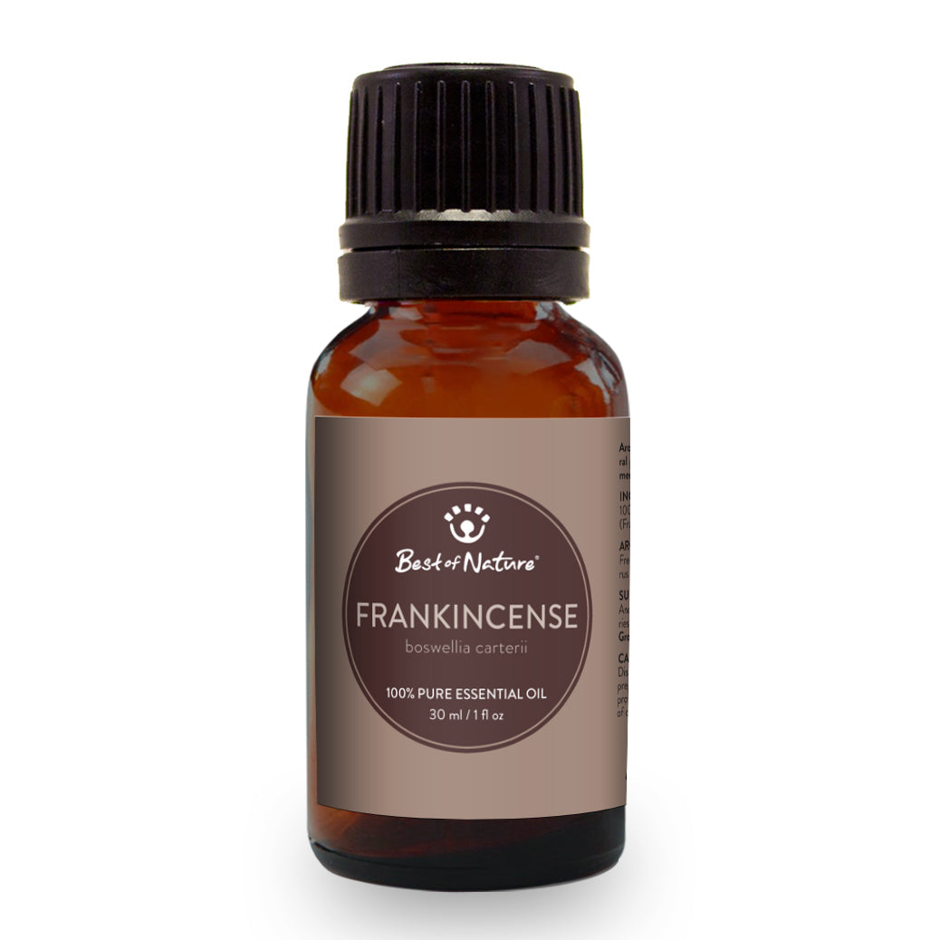 Bottle of 100% pure Frankincense Olibanum Essential Oil with a wooden background, showcasing its natural essence.