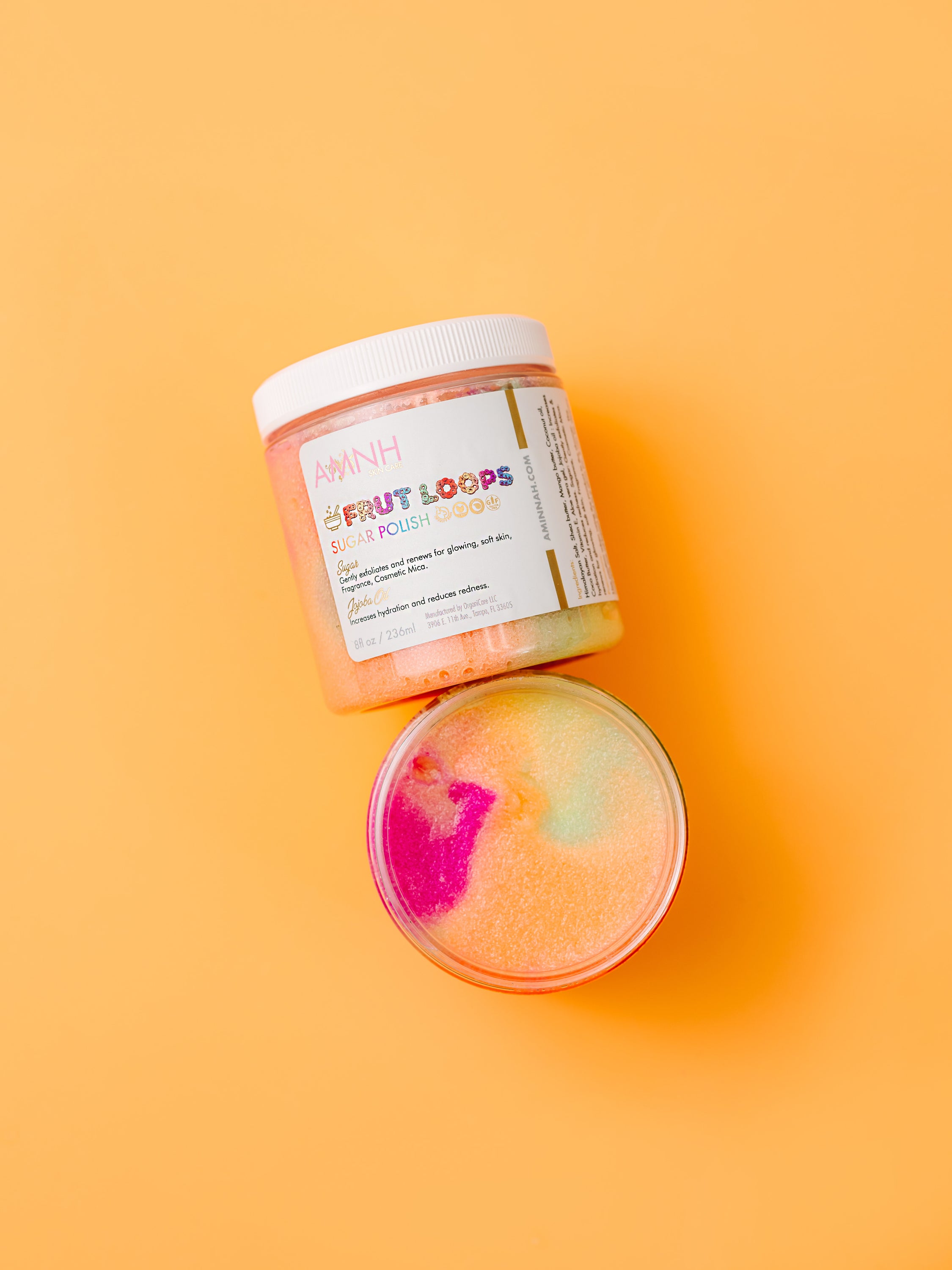 Frut Loops Sugar Scrub in a clear jar with colorful sugar granules resembling Fruit Loops cereal, showcasing its vibrant and fun appearance.