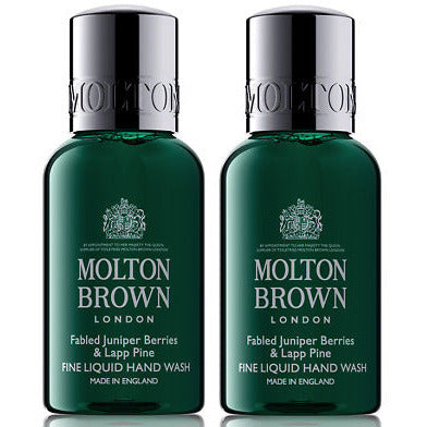 Molton Brown Gift Set featuring 2 x 30ml Festive Frankincense & Allspice Hand Wash and 2 x 30ml Fabled Juniper Berries & Lapp Pine Body Wash in elegant packaging.