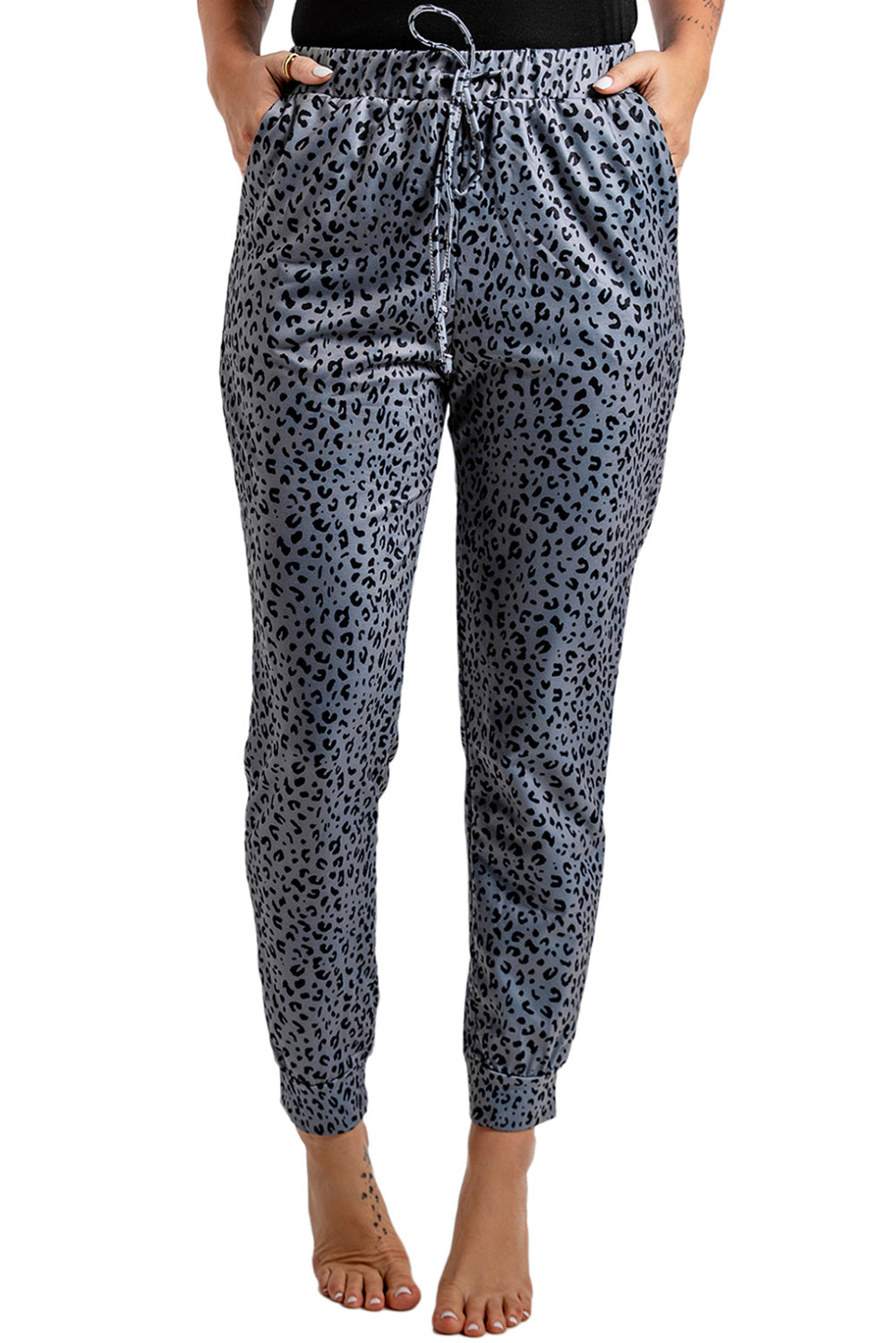 Gray joggers featuring a stylish leopard print design with a self-tie adjustable smocked waist for a comfortable fit.