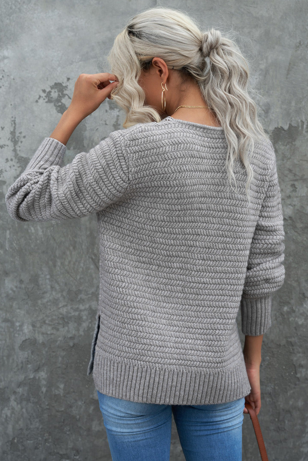 Gray loose sweater featuring a lace scalloped V-neck and side split design, perfect for a chic and comfortable look.