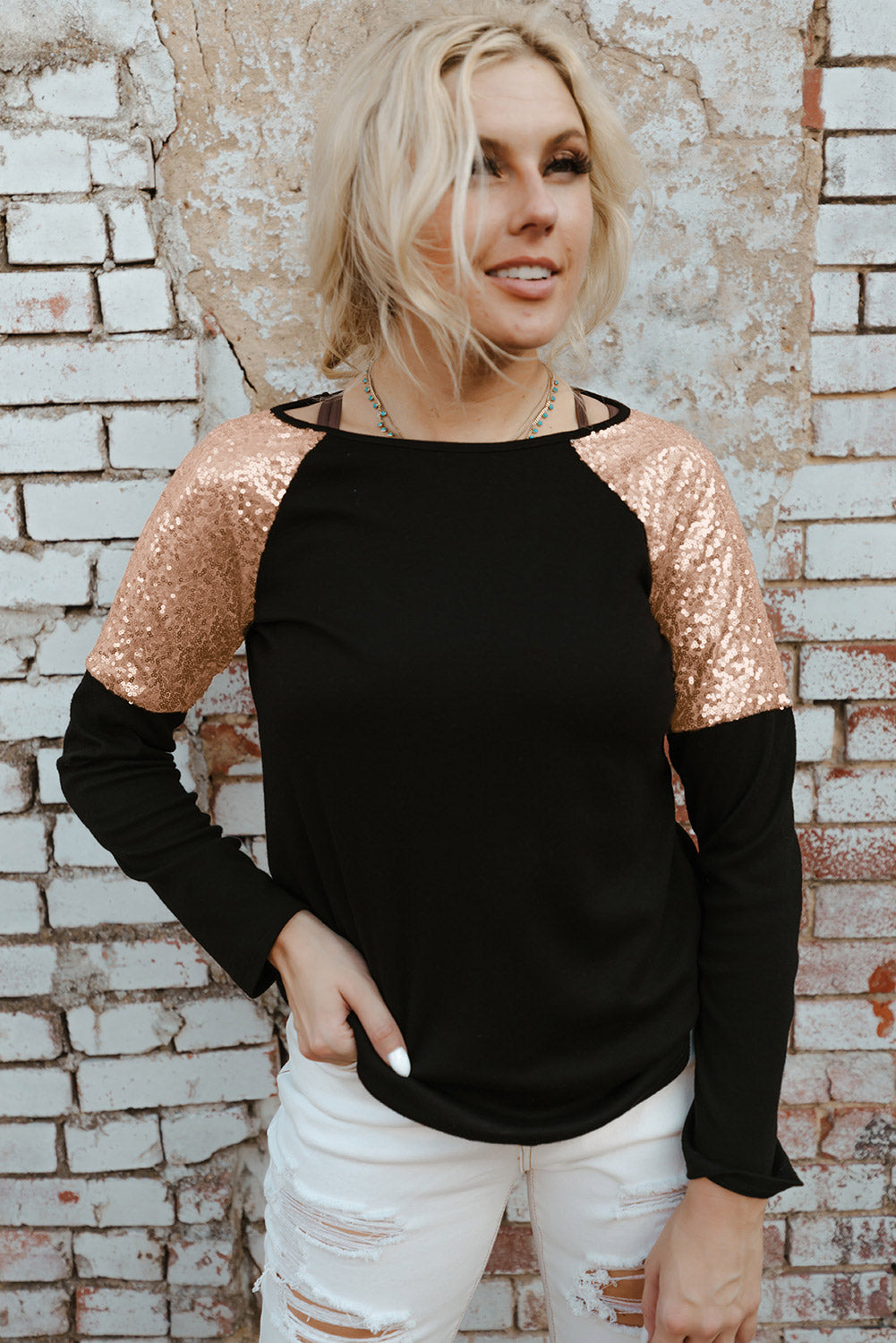 Gray long sleeve top with sequin shoulder detailing, showcasing a classic round neck and soft knit fabric.