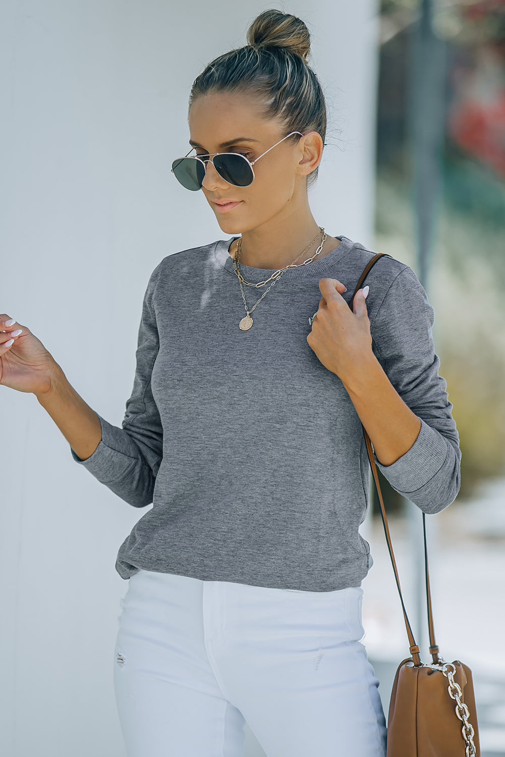 Gray solid crew neck pullover sweatshirt displayed on a mannequin, showcasing its long sleeves and comfortable fit.