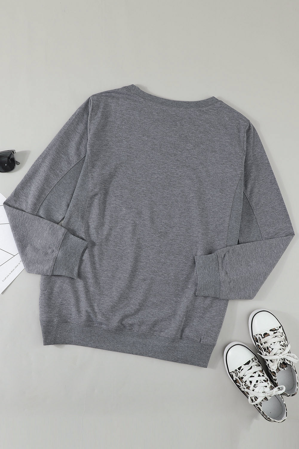 Gray solid crew neck pullover sweatshirt displayed on a mannequin, showcasing its long sleeves and comfortable fit.