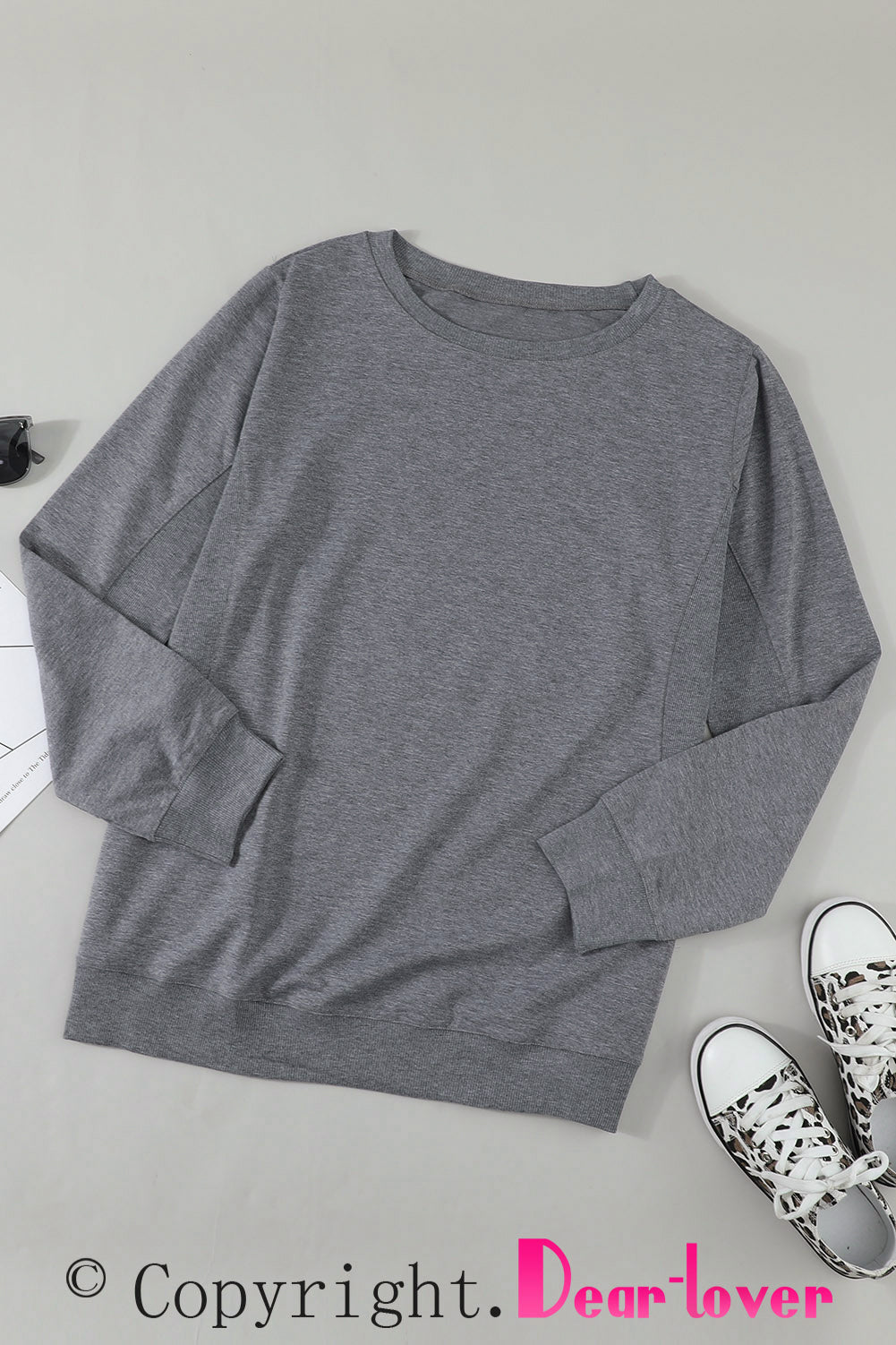 Gray solid crew neck pullover sweatshirt displayed on a mannequin, showcasing its long sleeves and comfortable fit.