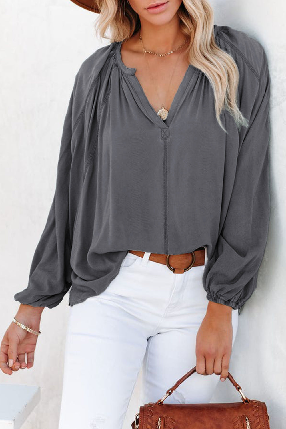 Gray Split V Neck Dolman Top featuring a relaxed fit, long sleeves with elastic cuffs, and a stylish high-low hemline.