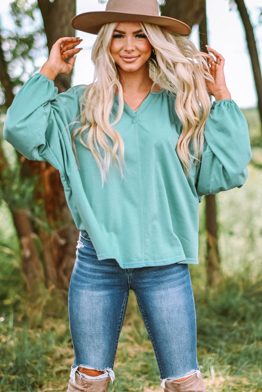 Gray Split V Neck Dolman Top featuring a relaxed fit, long sleeves with elastic cuffs, and a stylish high-low hemline.