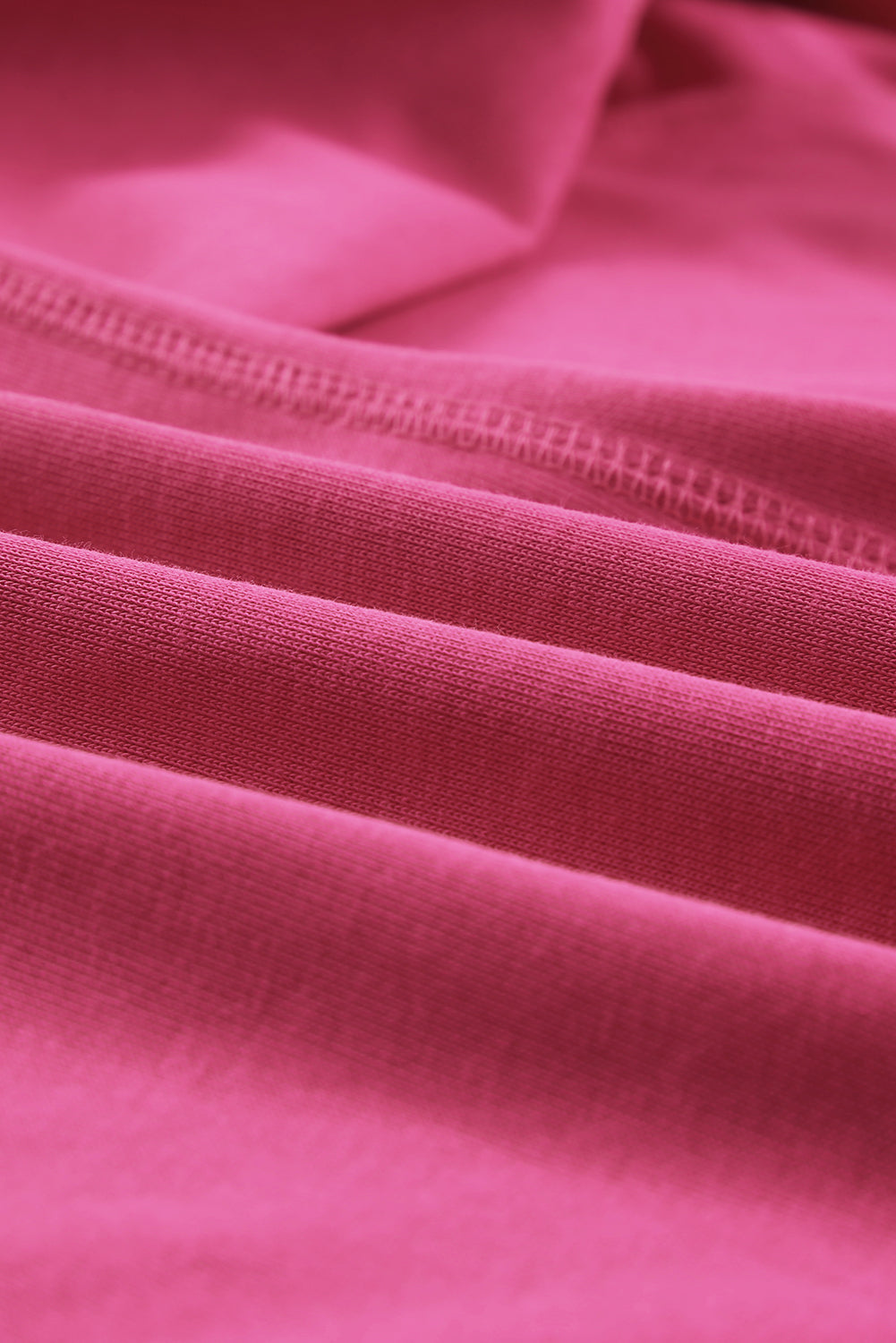 Gray Split V Neck Dolman Top featuring a relaxed fit, long sleeves with elastic cuffs, and a stylish high-low hemline.