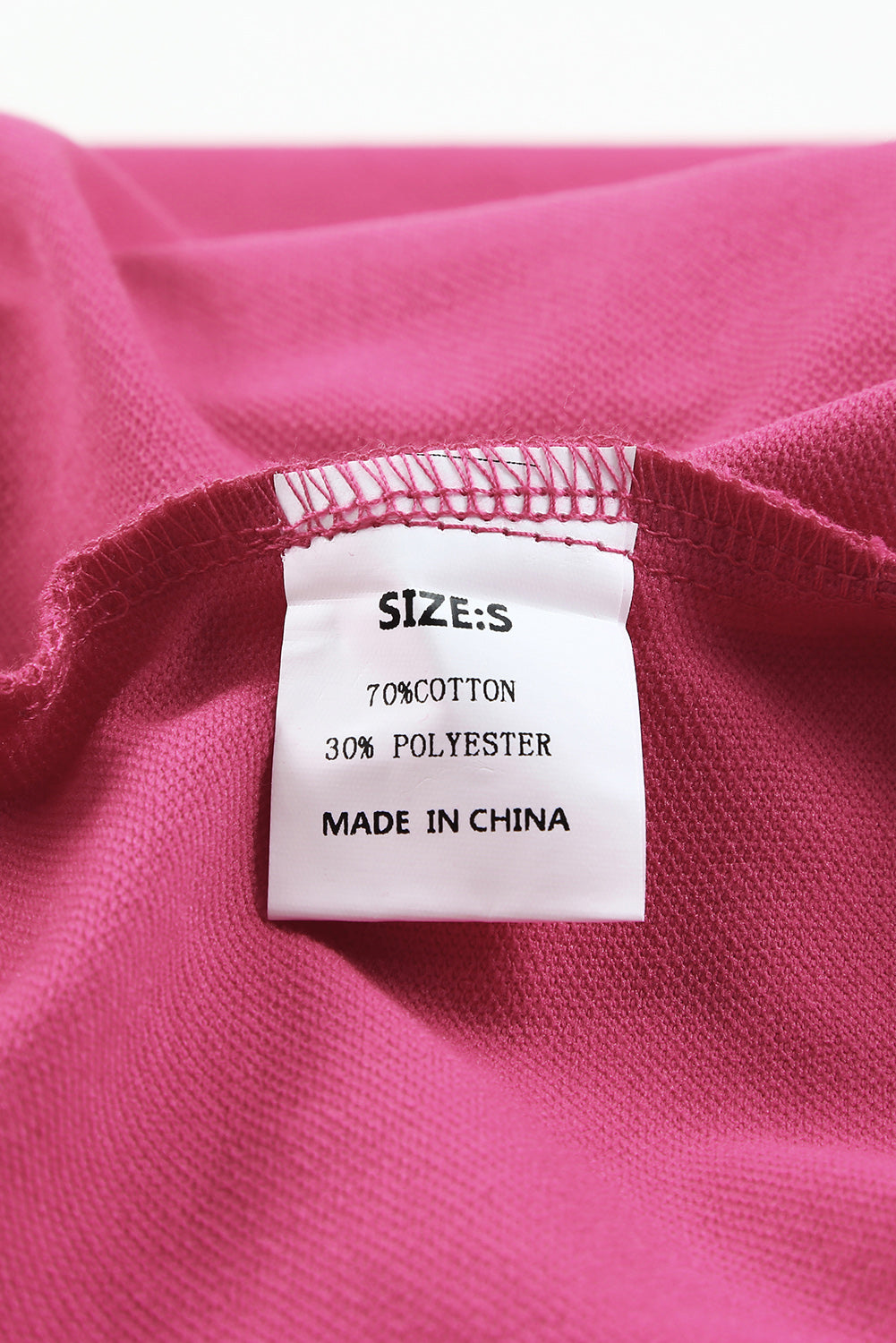 Gray Split V Neck Dolman Top featuring a relaxed fit, long sleeves with elastic cuffs, and a stylish high-low hemline.