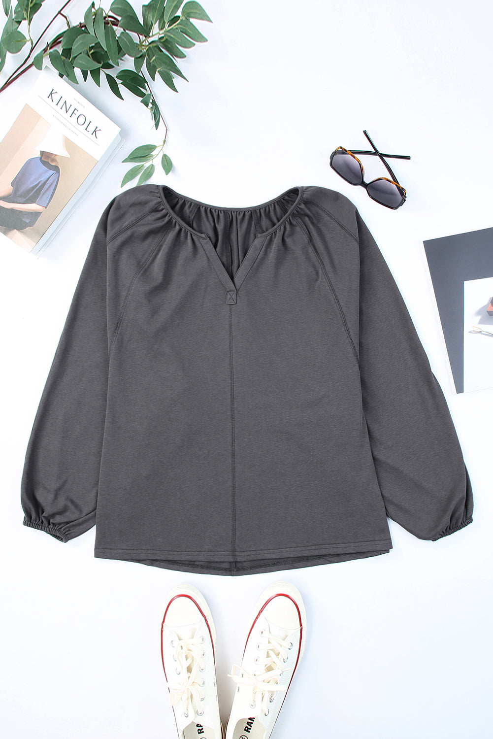 Gray Split V Neck Dolman Top featuring a relaxed fit, long sleeves with elastic cuffs, and a stylish high-low hemline.