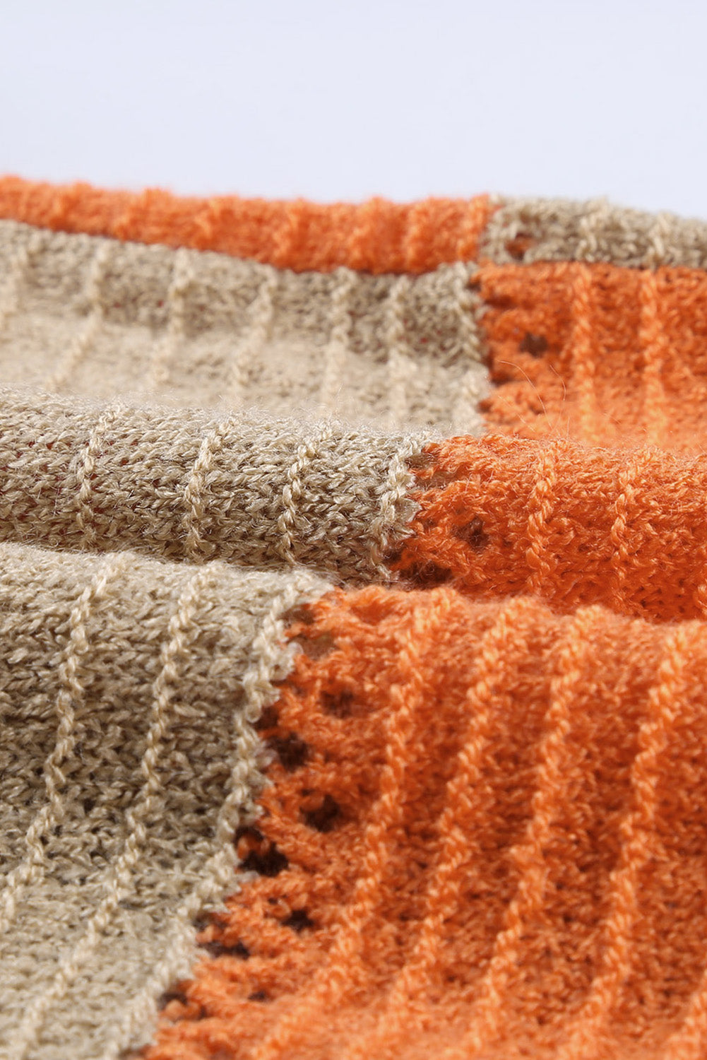 Gray zipped front colorblock hollow-out knit hoodie with drawstring hood and stylish design.