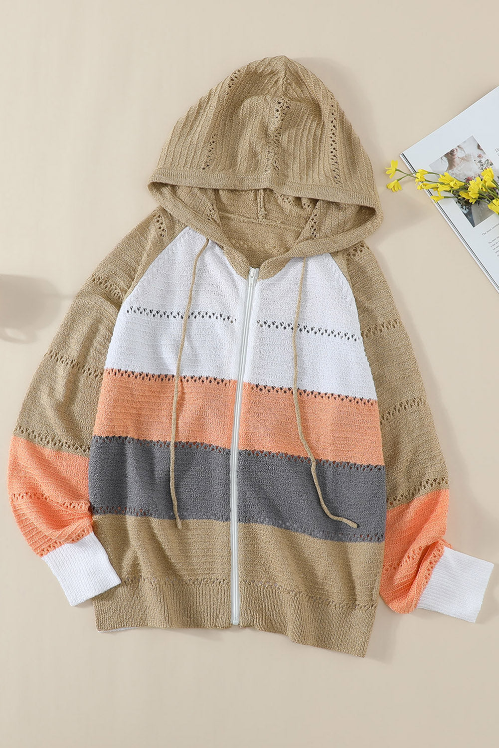 Gray zipped front colorblock hollow-out knit hoodie with drawstring hood and stylish design.
