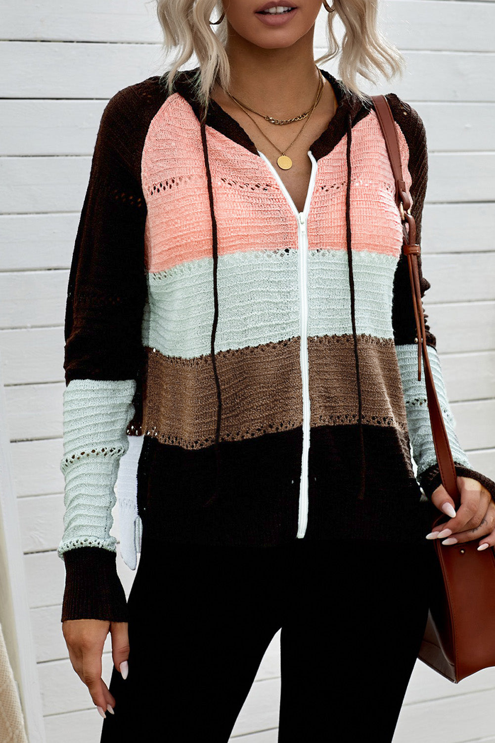 Gray zipped front colorblock hollow-out knit hoodie with drawstring hood and stylish design.