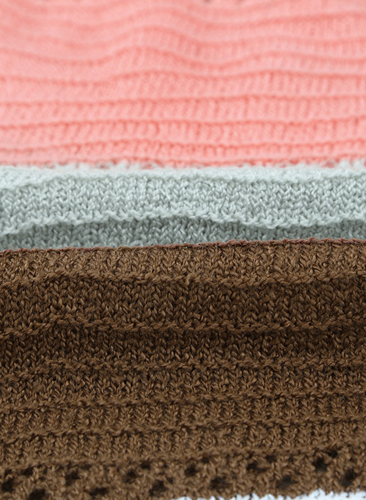 Gray zipped front colorblock hollow-out knit hoodie with drawstring hood and stylish design.