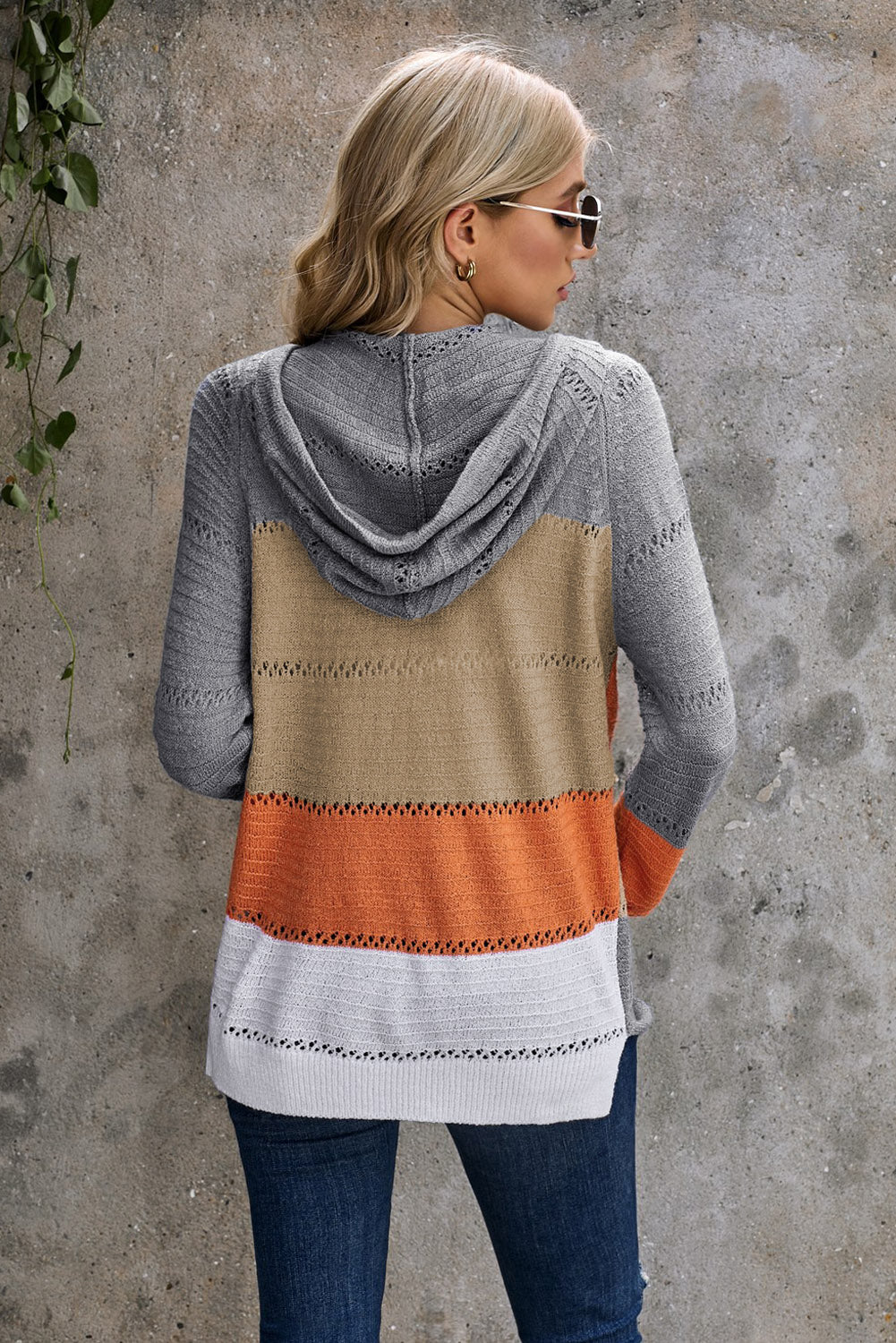 Gray zipped front colorblock hollow-out knit hoodie with drawstring hood and stylish design.