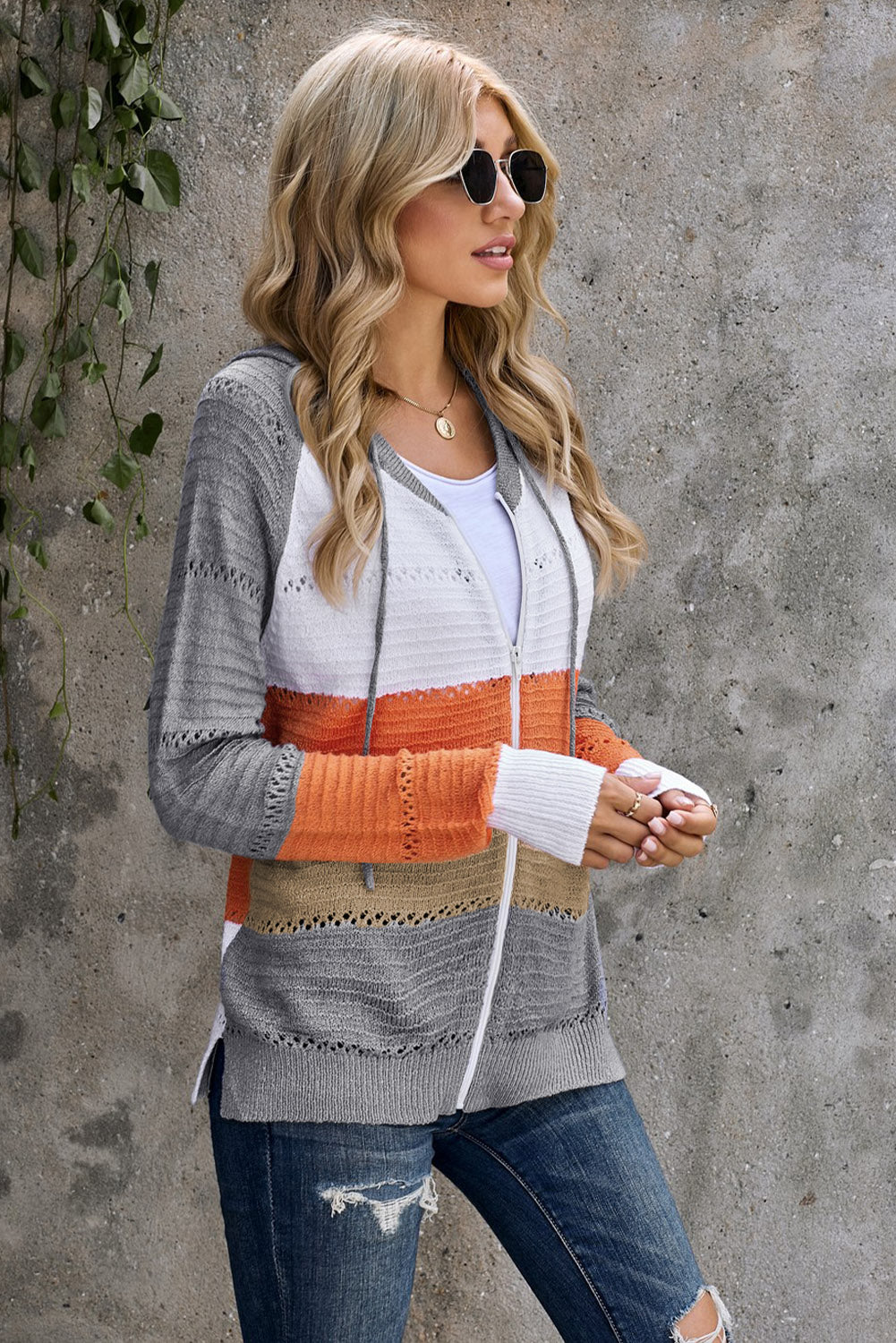 Gray zipped front colorblock hollow-out knit hoodie with drawstring hood and stylish design.