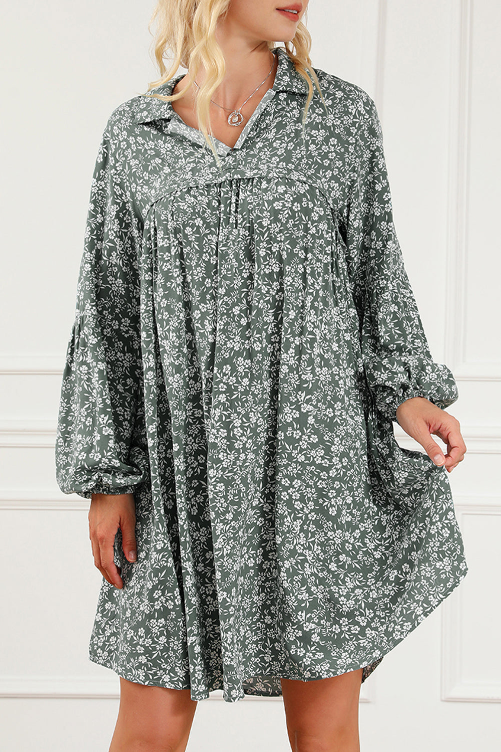 A stylish green floral print collared babydoll dress with puff sleeves, perfect for casual and dressy occasions.