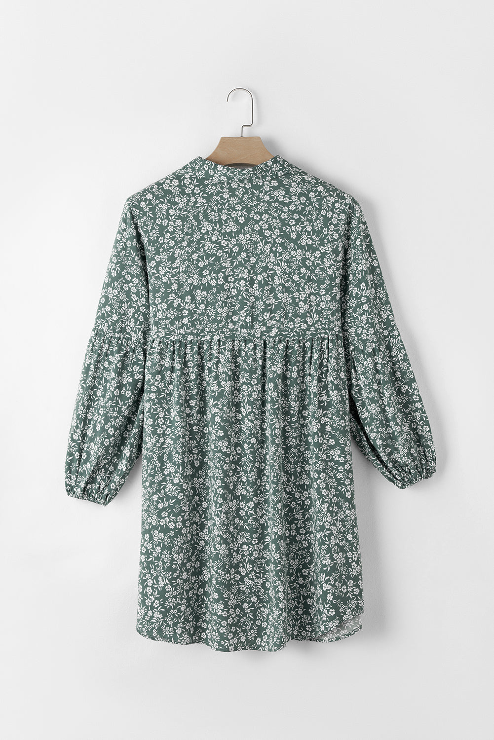 A stylish green floral print collared babydoll dress with puff sleeves, perfect for casual and dressy occasions.