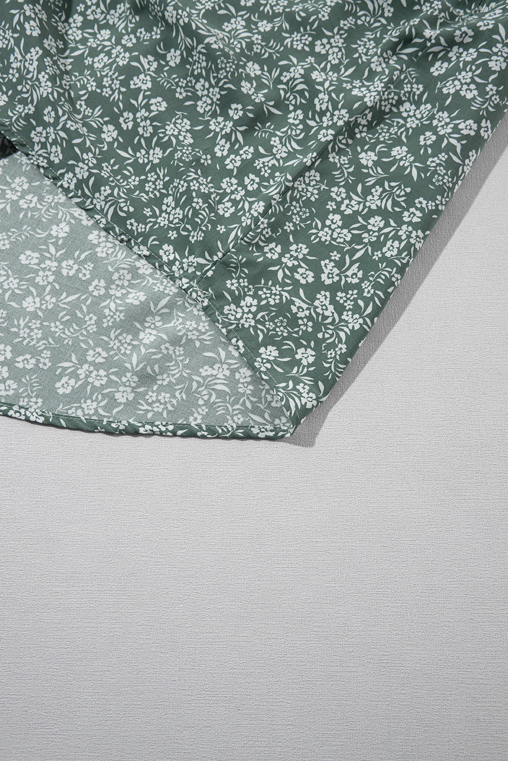 A stylish green floral print collared babydoll dress with puff sleeves, perfect for casual and dressy occasions.