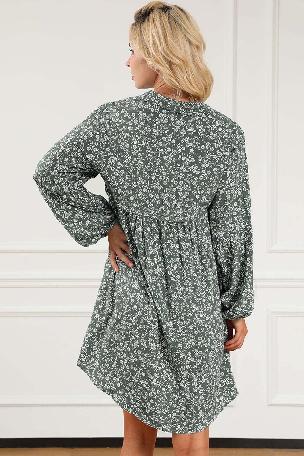 A stylish green floral print collared babydoll dress with puff sleeves, perfect for casual and dressy occasions.