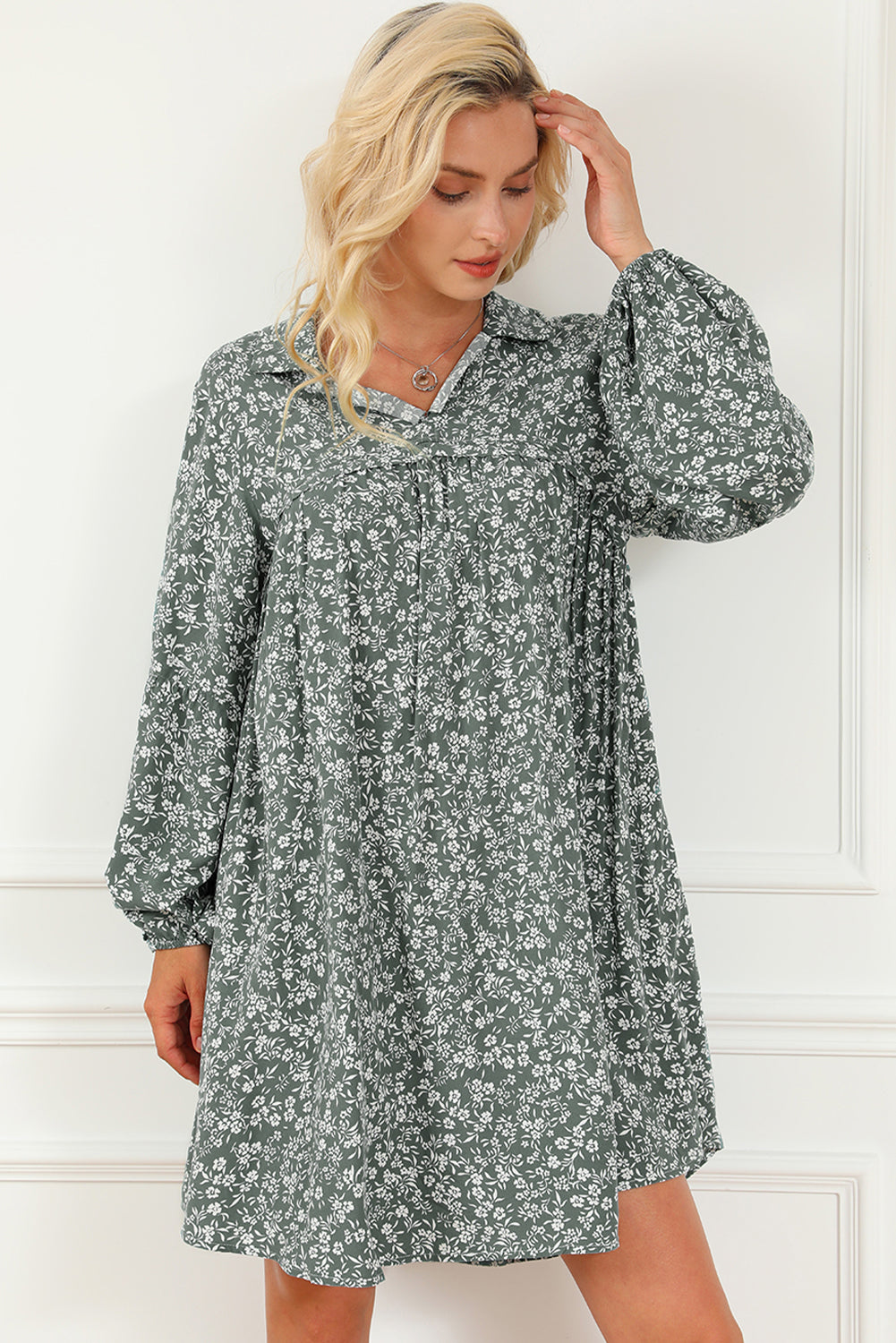 A stylish green floral print collared babydoll dress with puff sleeves, perfect for casual and dressy occasions.