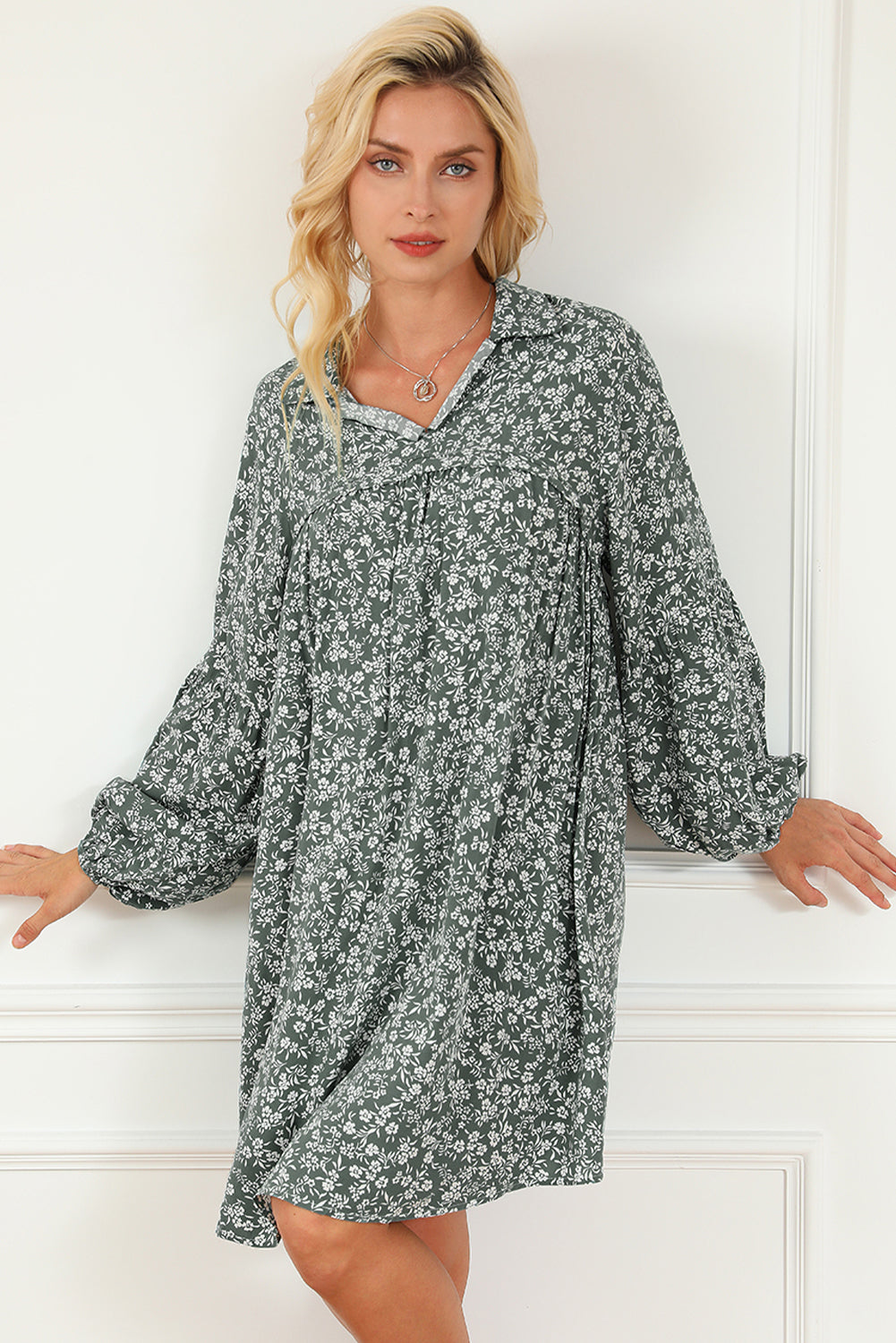 A stylish green floral print collared babydoll dress with puff sleeves, perfect for casual and dressy occasions.
