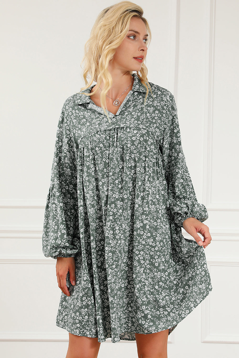 A stylish green floral print collared babydoll dress with puff sleeves, perfect for casual and dressy occasions.