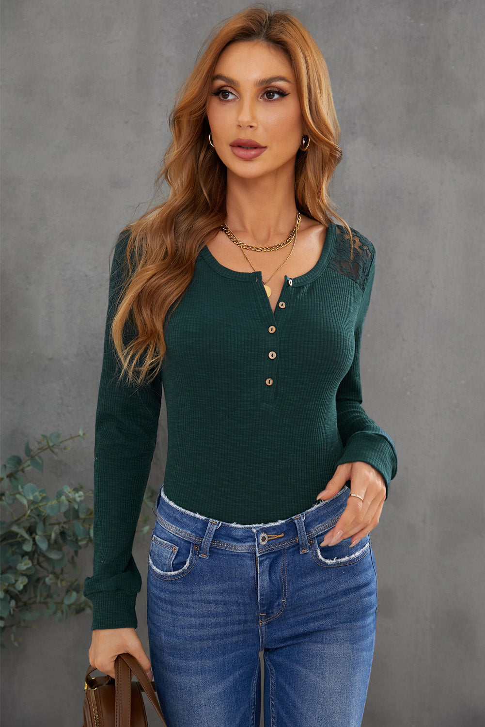 A stylish green henley top featuring a lace back and button detail, perfect for casual and semi-formal occasions.