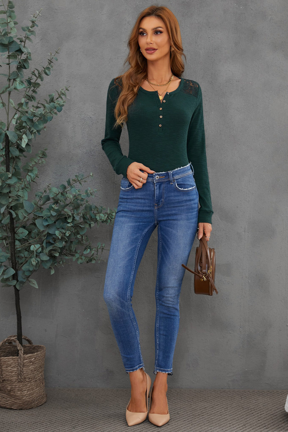 A stylish green henley top featuring a lace back and button detail, perfect for casual and semi-formal occasions.