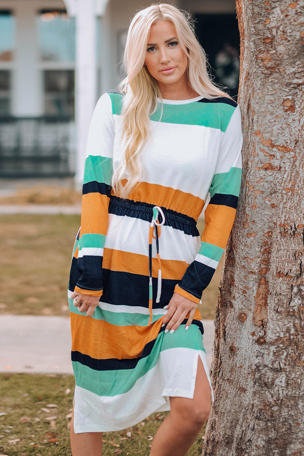 A stylish green multicolor block midi dress with a drawstring waist and long sleeves, perfect for fall fashion.
