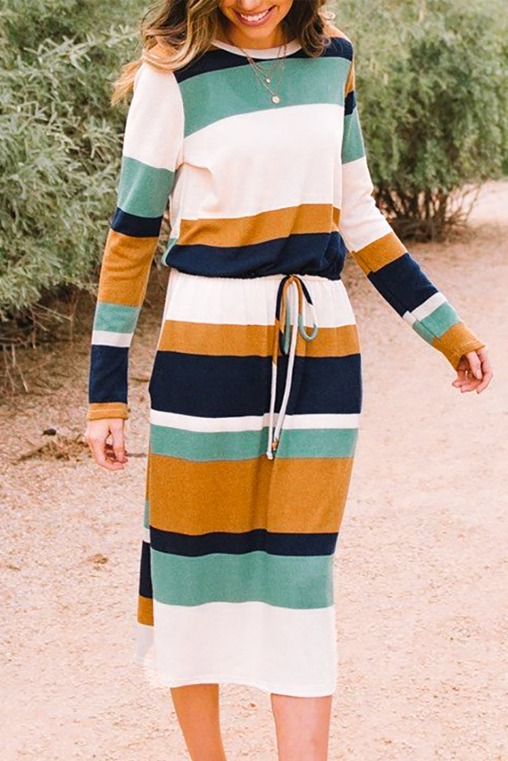 A stylish green multicolor block midi dress with a drawstring waist and long sleeves, perfect for fall fashion.