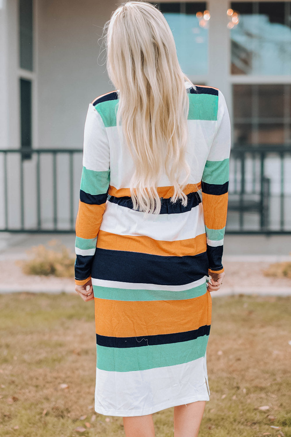 A stylish green multicolor block midi dress with a drawstring waist and long sleeves, perfect for fall fashion.