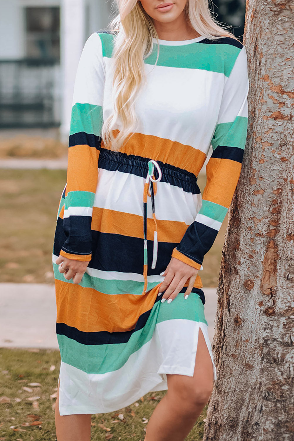 A stylish green multicolor block midi dress with a drawstring waist and long sleeves, perfect for fall fashion.