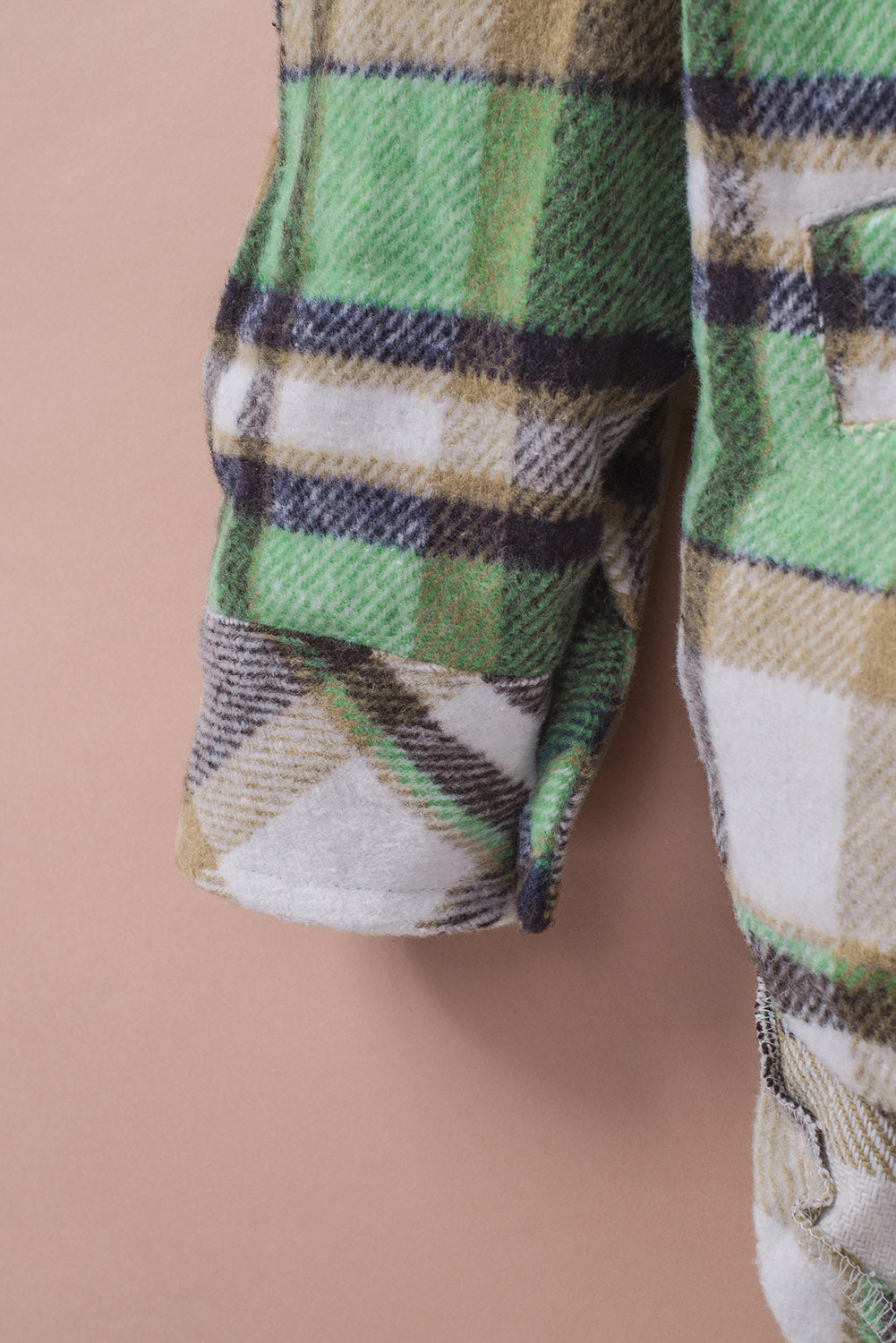 Green plaid shacket with pockets, featuring a turn-down collar and button closure, perfect for stylish layering.