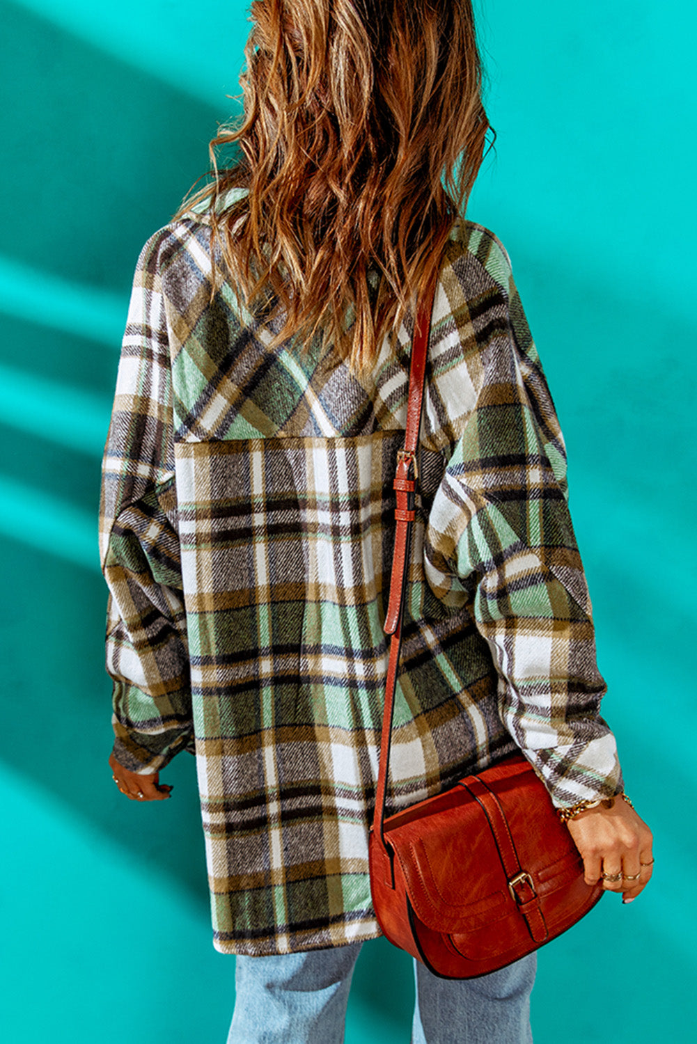 Green plaid shacket with pockets, featuring a turn-down collar and button closure, perfect for stylish layering.