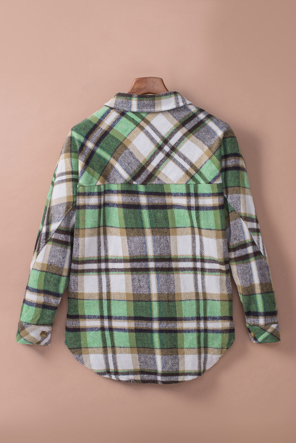 Green plaid shacket with pockets, featuring a turn-down collar and button closure, perfect for stylish layering.