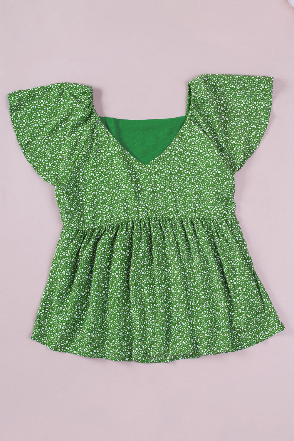 A stylish green plus size floral peplum top featuring a v-neck, flutter sleeves, and a flowy waist design, perfect for casual outings.