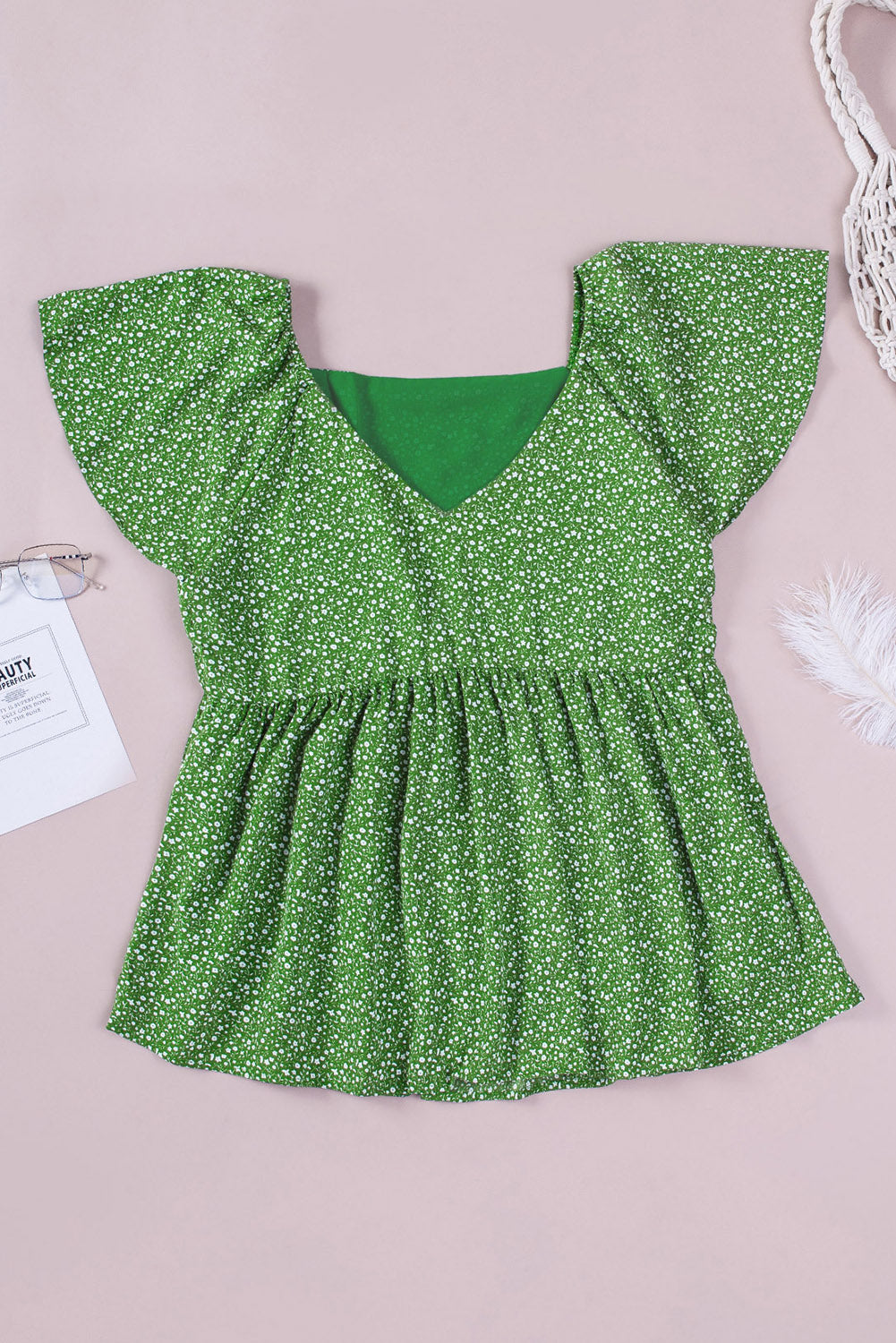 A stylish green plus size floral peplum top featuring a v-neck, flutter sleeves, and a flowy waist design, perfect for casual outings.
