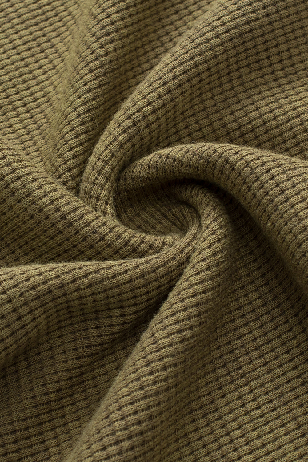 A stylish green long sleeve top with raw seams and a relaxed fit, perfect for casual wear.