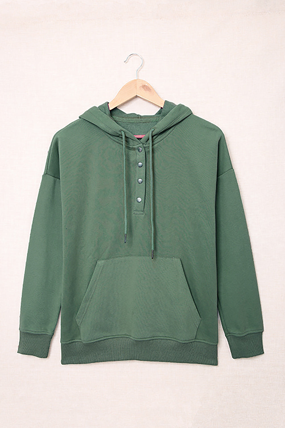 Green Snap Button Pullover Hoodie featuring a kangaroo pocket and drawstring hood, perfect for casual wear.