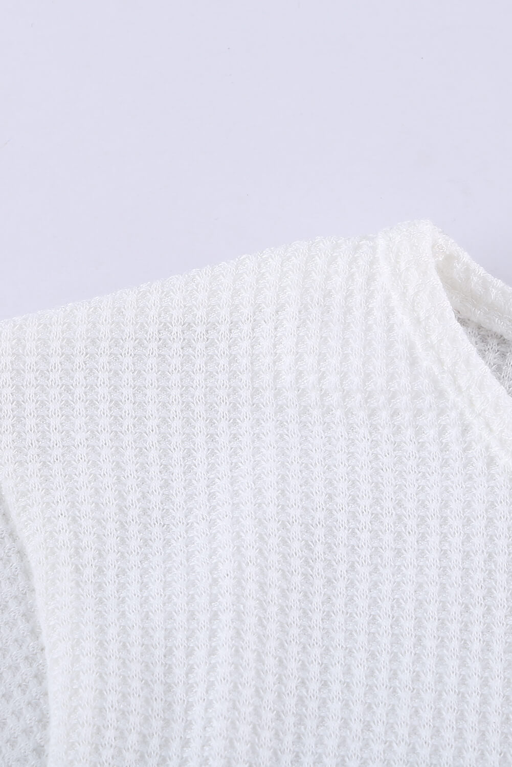 A stylish green top featuring colorblock and striped splicing design, perfect for casual wear.