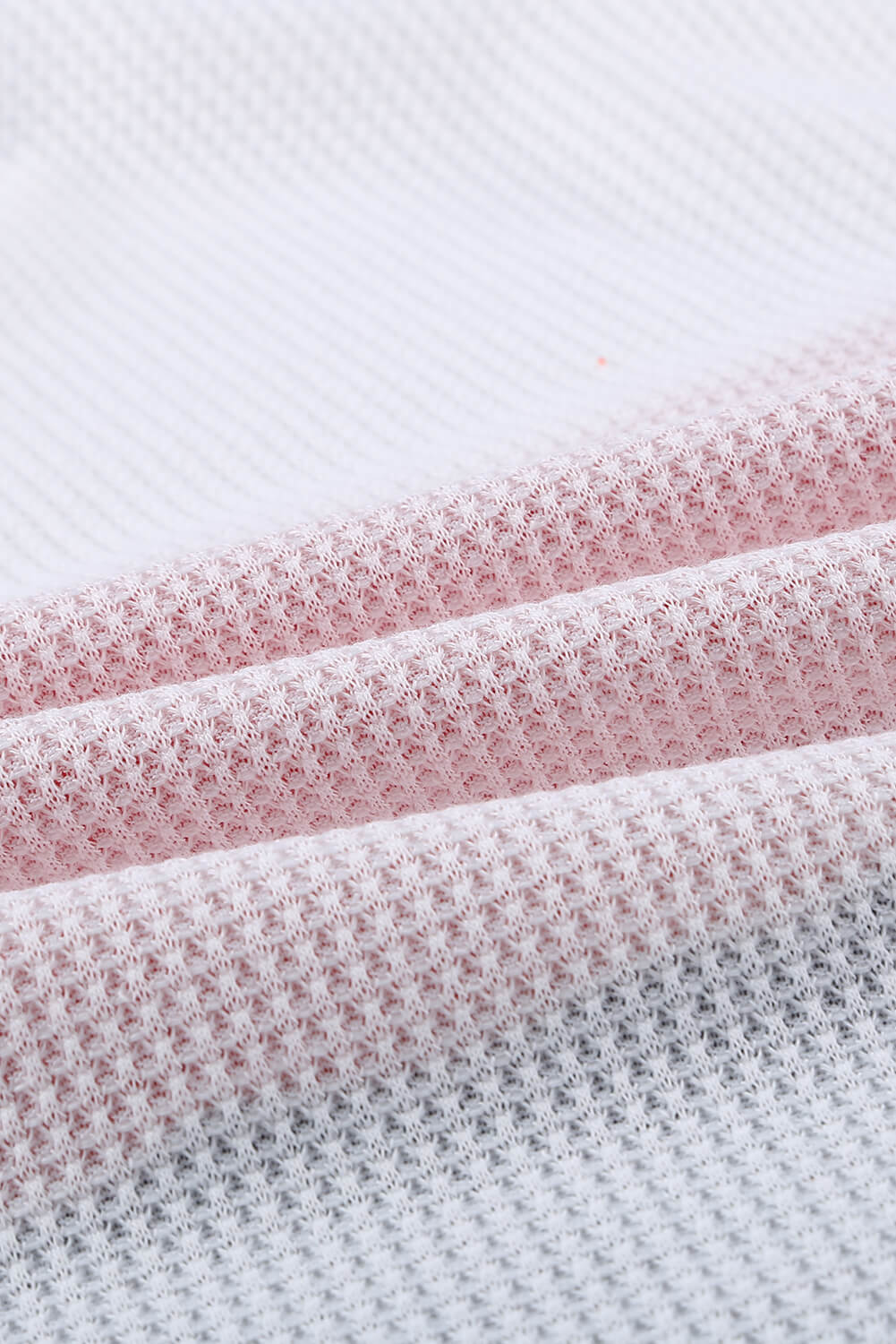 A stylish green top featuring colorblock and striped splicing design, perfect for casual wear.