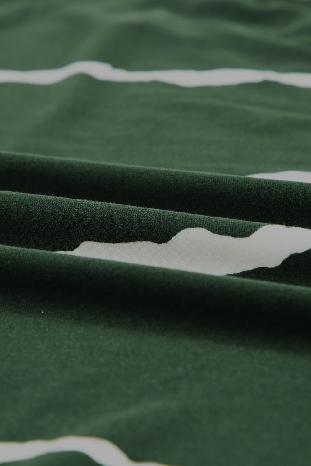 Green Tie-dye Stripe Casual T-Shirt displayed on a mannequin, showcasing its stylish design and soft fabric.