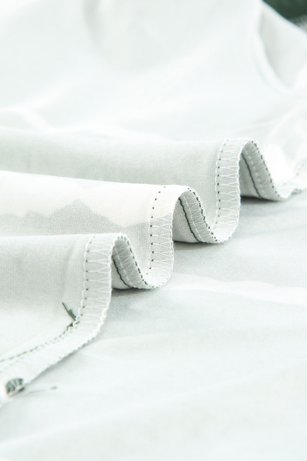 Green Tie-dye Stripe Casual T-Shirt displayed on a mannequin, showcasing its stylish design and soft fabric.