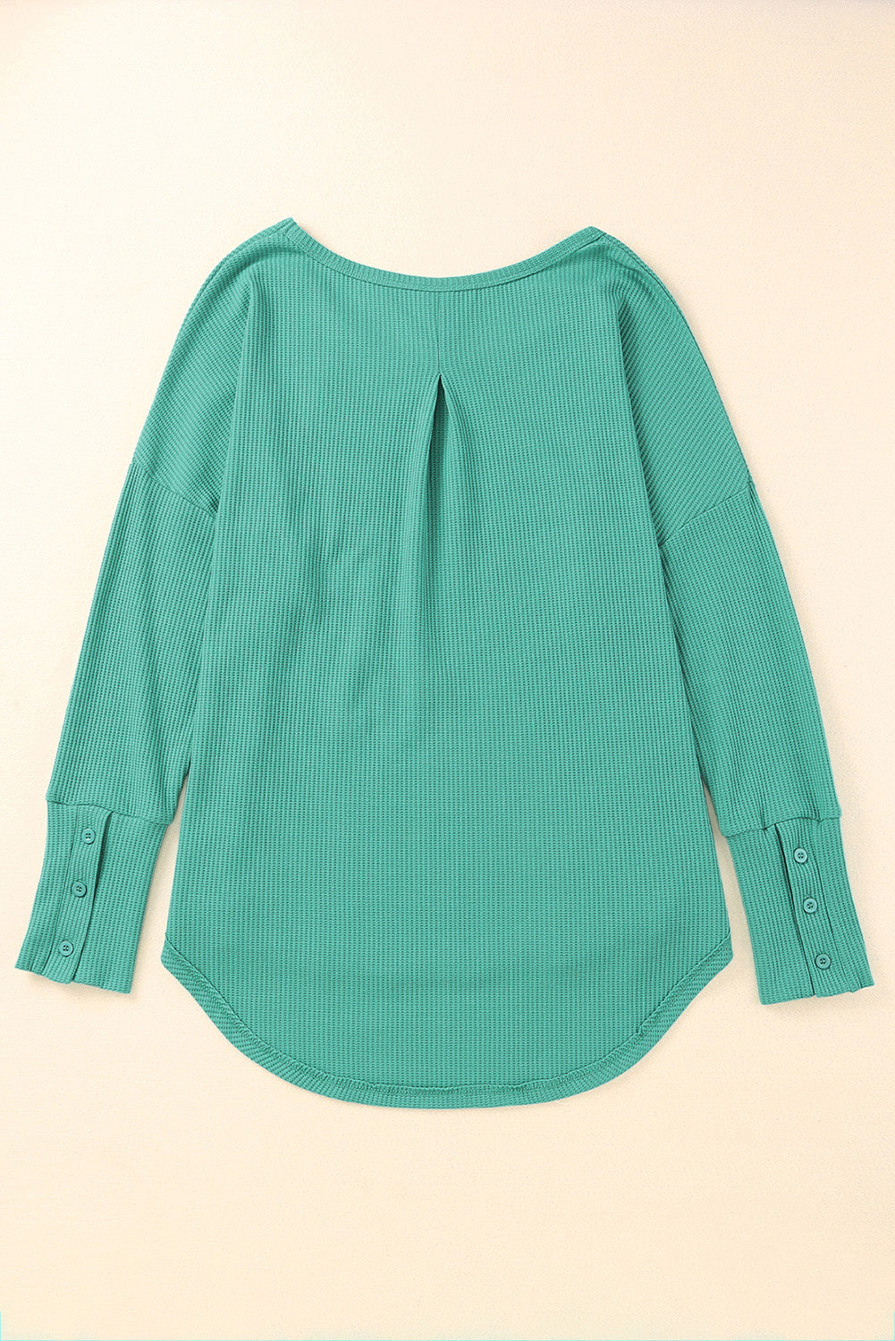 A stylish green waffle knit long sleeve top featuring splicing buttons and a crew neckline, perfect for casual wear.