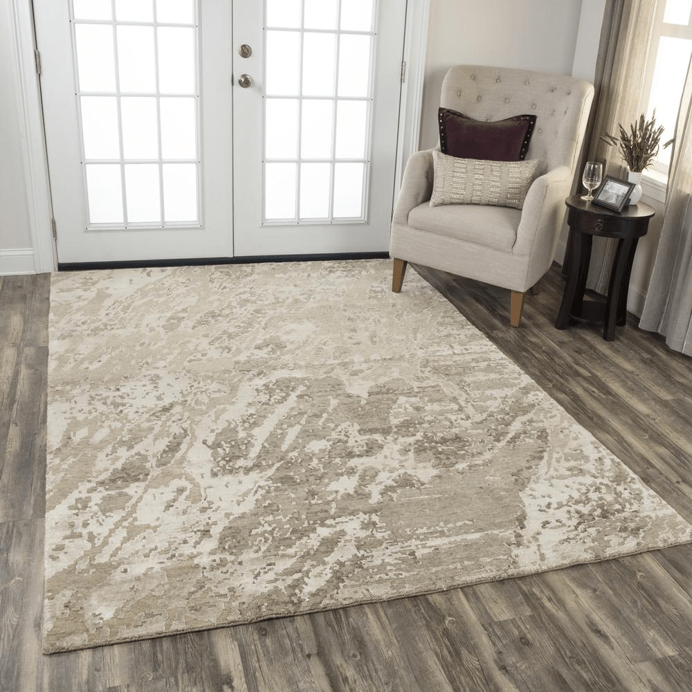 Hand knotted cut pile wool and viscose rug in beige and ivory abstract design, measuring 8' x 10', showcasing craftsmanship and quality.