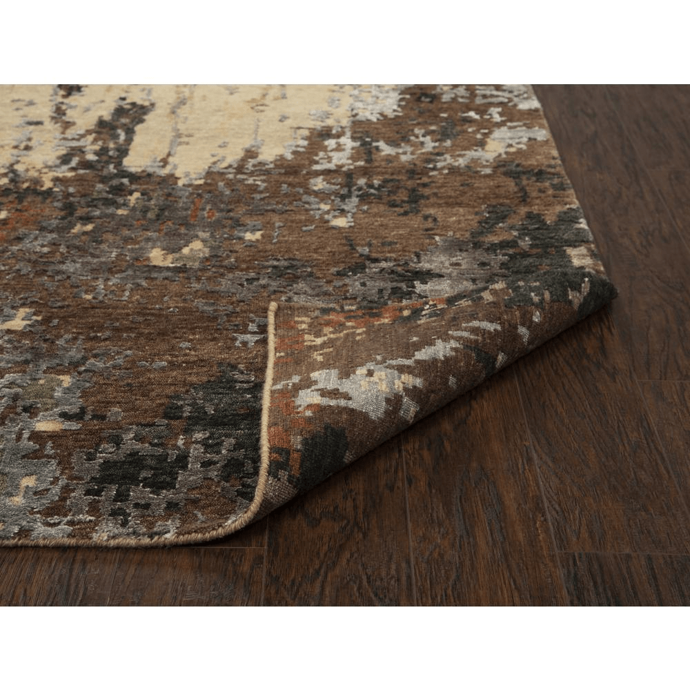 Hand knotted cut pile wool and viscose rug in rich earth tones, measuring 8' x 10', showcasing intricate textures and patterns.