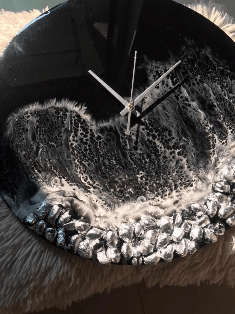 Handmade Black Ocean Wall Clock featuring intricate epoxy resin design in shades of blue and black, available in three sizes.