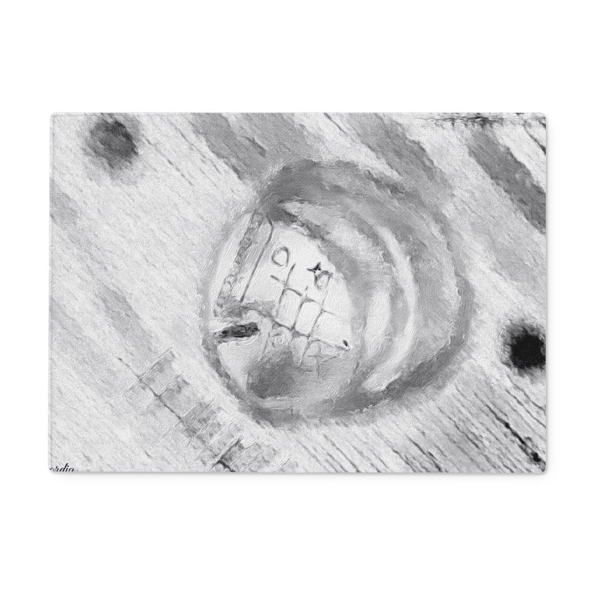 A sleek Head Glass Chopping Board made from durable tempered glass, showcasing its crystal-clear surface and modern design.