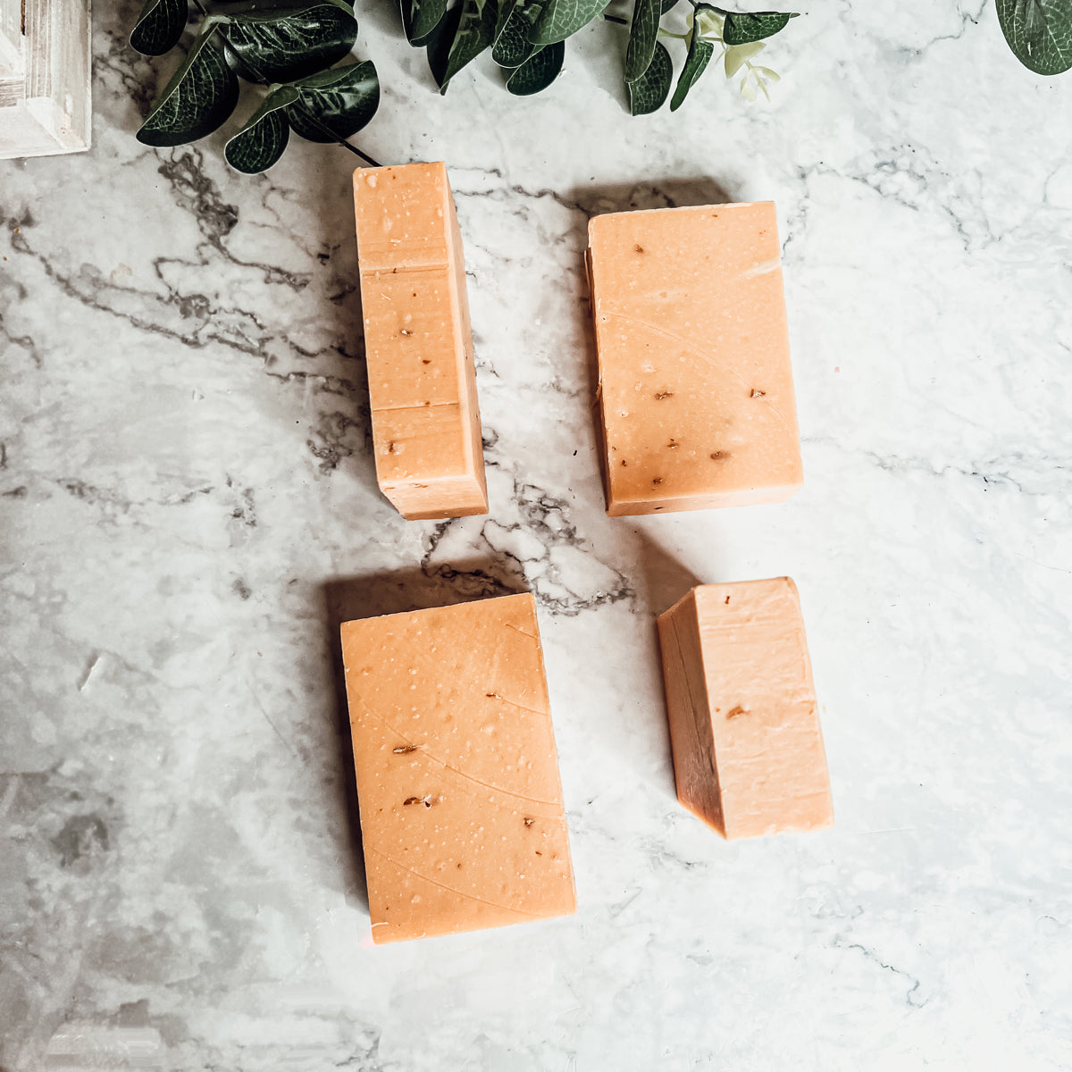 Handcrafted Honey, Orange & Turmeric soap bar with natural ingredients, showcasing its unique design and vibrant colors.